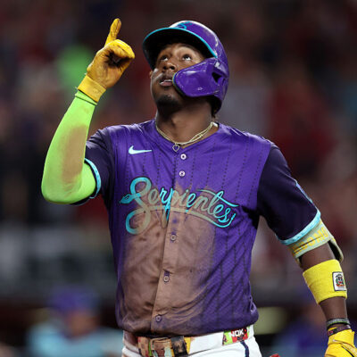 PHOENIX, ARIZONA - AUGUST 23: Geraldo Perdomo #2 of the Arizona Diamondbacks reacts while crossing home plate after hitting a two run home run against the Cincinnati Reds during the fourth inning at Chase Field on August 23, 2025 in Phoenix, Arizona. (Photo by Chris Coduto/Getty Images)