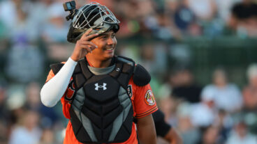 SARASOTA, FL - MARCH 15: Samuel Basallo #62 of the Baltimore Orioles smiles after catching in the third inning during the game between the New York Yankees and the Baltimore Orioles at Ed Smith Stadium on Saturday, March 15, 2025 in Sarasota, Florida. (Photo by Kelly Gavin/MLB Photos via Getty Images)