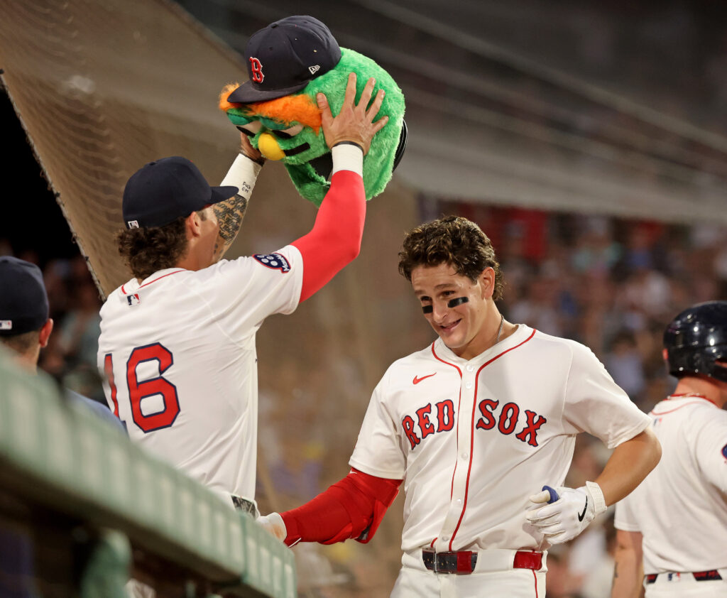 Boston, MA - July 7 - Jarren Duran (16) of the Boston Red Sox puts the Wally head on Roman Anthony after his two run homer during the fifth inning of the MLB game against the Colorado Rockies at Fenway Park. (Photo by Matt Stone/MediaNews Group/Boston Herald via Getty Images)