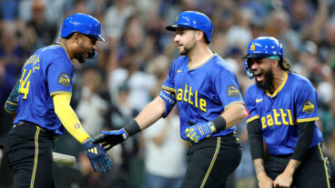 SEATTLE, WASHINGTON - AUGUST 08: Cal Raleigh #29 of the Seattle Mariners celebrates his three run home run with Julio Rodríguez #44 J.P. Crawford #3 during the eighth inning against the Tampa Bay Rays at T-Mobile Park on August 08, 2025 in Seattle, Washington. (Photo by Steph Chambers/Getty Images)