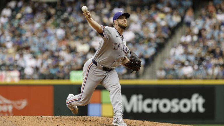 SEATTLE, WASHINGTON - AUGUST 02: Merrill Kelly #23 of the Texas Rangers throws a pitch during the third inning against the Seattle Mariners at T-Mobile Park on August 02, 2025 in Seattle, Washington. (Photo by Alika Jenner/Getty Images)