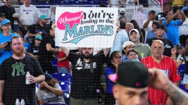 MIAMI, FLORIDA - AUGUST 02: A fan holds up a sign after the Miami Marlins defeated the New York Yankees at loanDepot park on August 02, 2025 in Miami, Florida. (Photo by Rich Storry/Getty Images)
