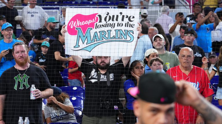 MIAMI, FLORIDA - AUGUST 02: A fan holds up a sign after the Miami Marlins defeated the New York Yankees at loanDepot park on August 02, 2025 in Miami, Florida. (Photo by Rich Storry/Getty Images)