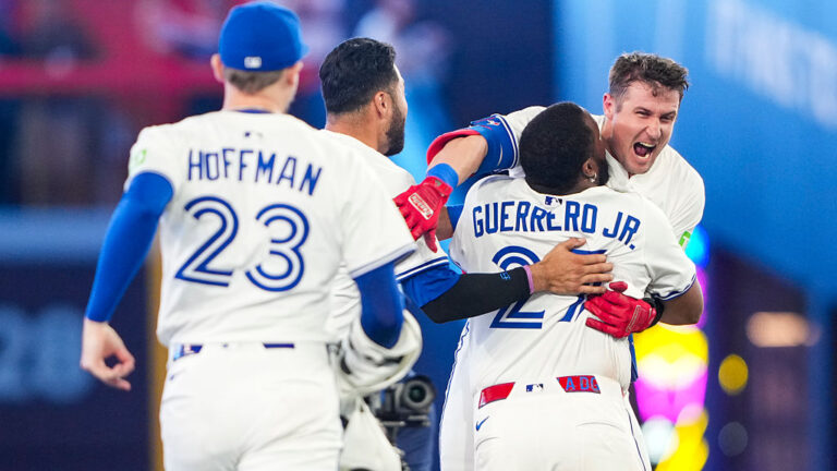 TORONTO, CANADA - SEPTEMBER 9: Tyler Heineman #55 of the Toronto Blue Jays hugs Vladimir Guerrero Jr. #27 after hitting a walk off single against the Houston Astros during the tenth inning in their MLB game at Rogers Centre on September 9, 2025 in Toronto, Canada. (Photo by Kevin Sousa/Getty Images)
