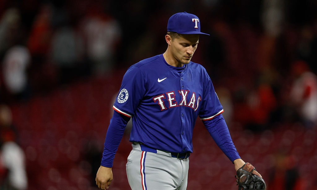 CINCINNATI, OHIO - APRIL 1: Corey Seager #5 of the Texas Rangers walks off the field after the final out in the ninth inning against the Cincinnati Reds at Great American Ball Park on April 1, 2025 in Cincinnati, Ohio. (Photo by Brandon Sloter/Getty Images)