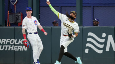 ATLANTA, GEORGIA - JULY 15: Fernando Tatis Jr. #23 of the San Diego Padres throws a ball in from center field as Pete Crow-Armstrong #4 of the Chicago Cubs looks on during the fourth inning of the MLB All-Star Game at Truist Park on July 15, 2025 in Atlanta, Georgia. (Photo by Jamie Squire/Getty Images)
