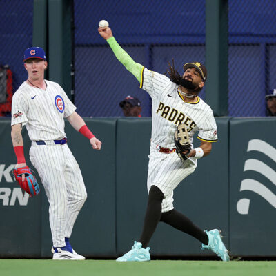 ATLANTA, GEORGIA - JULY 15: Fernando Tatis Jr. #23 of the San Diego Padres throws a ball in from center field as Pete Crow-Armstrong #4 of the Chicago Cubs looks on during the fourth inning of the MLB All-Star Game at Truist Park on July 15, 2025 in Atlanta, Georgia. (Photo by Jamie Squire/Getty Images)
