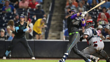 TAMPA, FLORIDA - AUGUST 22: Carson Williams #77 of the Tampa Bay Rays hits a two-run home run in the seventh inning against the St. Louis Cardinals during his Major League Debut at George M. Steinbrenner Field on August 22, 2025 in Tampa, Florida. (Photo by Julio Aguilar/Getty Images)