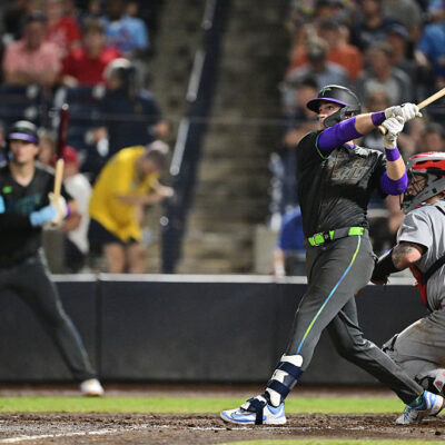 TAMPA, FLORIDA - AUGUST 22: Carson Williams #77 of the Tampa Bay Rays hits a two-run home run in the seventh inning against the St. Louis Cardinals during his Major League Debut at George M. Steinbrenner Field on August 22, 2025 in Tampa, Florida. (Photo by Julio Aguilar/Getty Images)