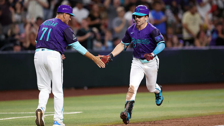 PHOENIX, ARIZONA - SEPTEMBER 05: Corbin Carroll #7 high fives third base coach Tim Bogar #71 of the Arizona Diamondbacks after hitting a three run home run against the Boston Red Sox during the eighth inning at Chase Field on September 05, 2025 in Phoenix, Arizona. The Diamondbacks defeated the Red Sox 10-5. (Photo by Chris Coduto/Getty Images)