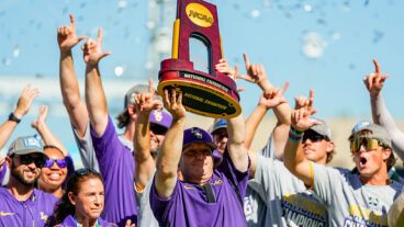 OMAHA, NEBRASKA - JUNE 22: Head coach Jay Johnson of the LSU Tigers hoists the championship trophy after defeating the Coastal Carolina Chanticleers to win the NCAA College World Series baseball finals at Charles Schwab Field on June 22, 2025 in Omaha, Nebraska. (Photo by Jay Biggerstaff/Getty Images)