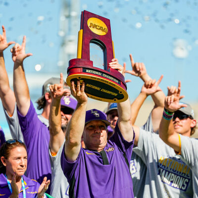 OMAHA, NEBRASKA - JUNE 22: Head coach Jay Johnson of the LSU Tigers hoists the championship trophy after defeating the Coastal Carolina Chanticleers to win the NCAA College World Series baseball finals at Charles Schwab Field on June 22, 2025 in Omaha, Nebraska. (Photo by Jay Biggerstaff/Getty Images)