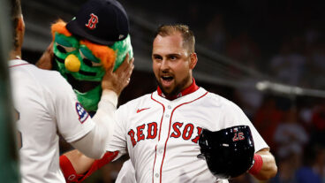 BOSTON, MA - SEPTEMBER 2: Nathaniel Lowe #37 of the Boston Red Sox gets ready to have the Wally the Green Monster helmet put on his head after his home run against the Cleveland Guardians during the third inning at Fenway Park on September 2, 2025 in Boston, Massachusetts. (Photo By Winslow Townson/Getty Images)