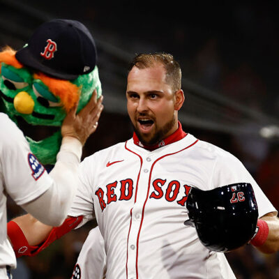 BOSTON, MA - SEPTEMBER 2: Nathaniel Lowe #37 of the Boston Red Sox gets ready to have the Wally the Green Monster helmet put on his head after his home run against the Cleveland Guardians during the third inning at Fenway Park on September 2, 2025 in Boston, Massachusetts. (Photo By Winslow Townson/Getty Images)
