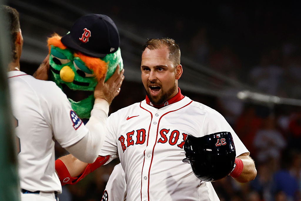 BOSTON, MA - SEPTEMBER 2: Nathaniel Lowe #37 of the Boston Red Sox gets ready to have the Wally the Green Monster helmet put on his head after his home run against the Cleveland Guardians during the third inning at Fenway Park on September 2, 2025 in Boston, Massachusetts. (Photo By Winslow Townson/Getty Images)