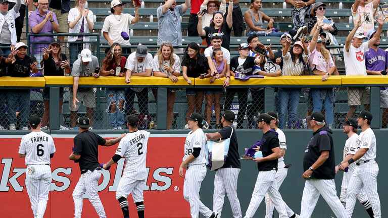 DENVER, COLORADO - SEPTEMBER 21: The Colorado Rockies circle the field after their final home game, defeationg the Los Angeles Angels at Coors Field on September 21, 2025 in Denver, Colorado. (Photo by Matthew Stockman/Getty Images)