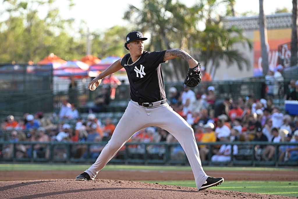 SARASOTA, FLORIDA - MARCH 15, 2025: Carlos Lagrange #30 of the New York Yankees pitches during the first inning of a Spring Breakout game against the Baltimore Orioles at Ed Smith Stadium on March 15, 2025 in Clearwater, Florida. (Photo by Diamond Images via Getty Images)