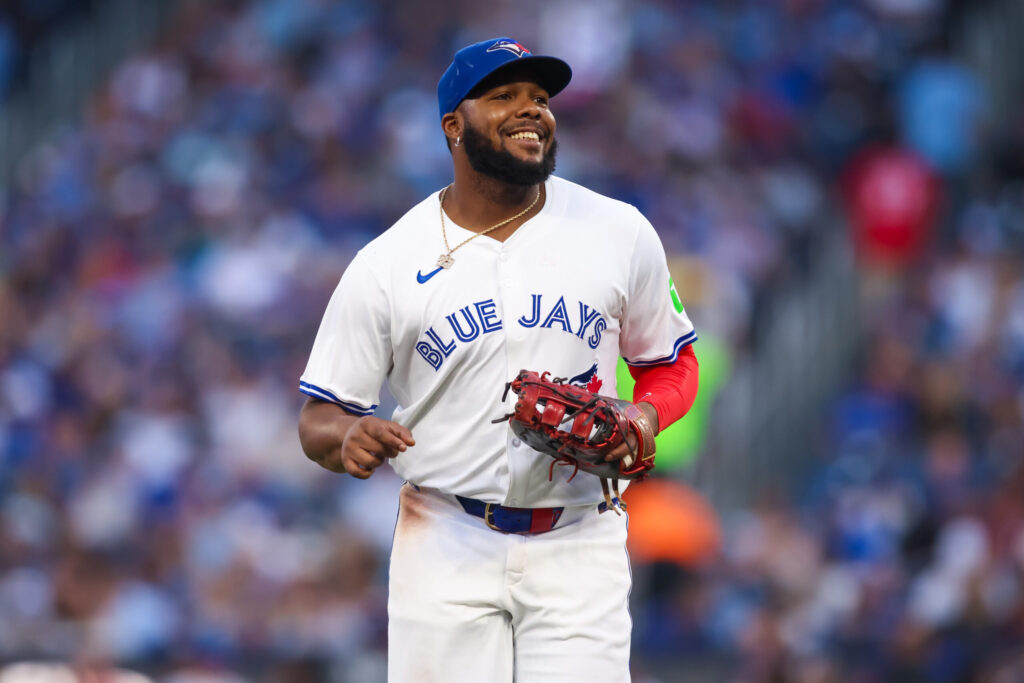 TORONTO, CANADA - JULY 22: Vladimir Guerrero Jr. #27 of the Toronto Blue Jays smiles as he jogs off the field during their MLB game against the New York Yankees at Rogers Centre on July 22, 2025 in Toronto, Ontario, Canada. (Photo by Cole Burston/Getty Images)