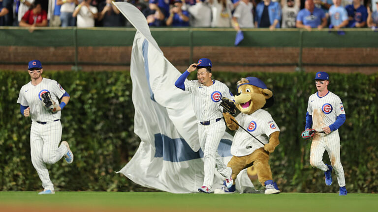 CHICAGO, ILLINOIS - OCTOBER 02: Seiya Suzuki #27 of the Chicago Cubs celebrates with teammates after defeating the San Diego Padres in game three of the National League Wild Card Series at Wrigley Field on October 02, 2025 in Chicago, Illinois. (Photo by Michael Reaves/Getty Images)