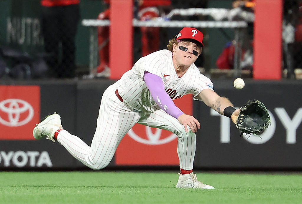 PHILADELPHIA, PENNSYLVANIA - OCTOBER 04: Harrison Bader #2 of the Philadelphia Phillies dives to make a catch in centerfield in the fifth inning against the Los Angeles Dodgers in game one of the Division Series at Citizens Bank Park on October 04, 2025 in Philadelphia, Pennsylvania. (Photo by Hunter Martin/Getty Images)