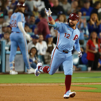 LOS ANGELES, CALIFORNIA - OCTOBER 08: Kyle Schwarber #12 of the Philadelphia Phillies reacts after hitting a solo home run against the Los Angeles Dodgers during the fourth inning in game three of the National League Division Series at Dodger Stadium on October 08, 2025 in Los Angeles, California. (Photo by Harry How/Getty Images)