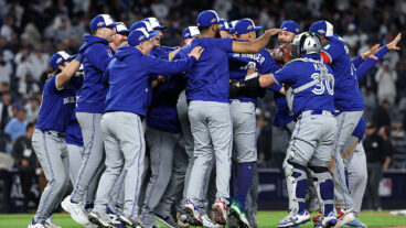 NEW YORK, NEW YORK - OCTOBER 08: Toronto Blue Jays players celebrate on the field after defeating the New York Yankees in game four of the American League Division Series at Yankee Stadium on October 08, 2025 in New York City. (Photo by Al Bello/Getty Images)