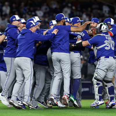 NEW YORK, NEW YORK - OCTOBER 08: Toronto Blue Jays players celebrate on the field after defeating the New York Yankees in game four of the American League Division Series at Yankee Stadium on October 08, 2025 in New York City. (Photo by Al Bello/Getty Images)
