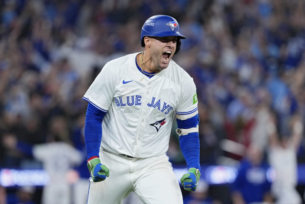 TORONTO, ONTARIO - OCTOBER 20: George Springer #4 of the Toronto Blue Jays celebrates after hitting a three-run home run against the Seattle Mariners during the seventh inning in game seven of the American League Championship Series at the Rogers Centre on October 20, 2025 in Toronto, Ontario. (Photo by Mark Blinch/Getty Images)