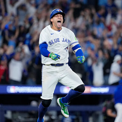TORONTO, ONTARIO - OCTOBER 20: George Springer #4 of the Toronto Blue Jays celebrates after hitting a three-run home run against the Seattle Mariners during the seventh inning in game seven of the American League Championship Series at the Rogers Centre on October 20, 2025 in Toronto, Ontario. (Photo by Mark Blinch/Getty Images)
