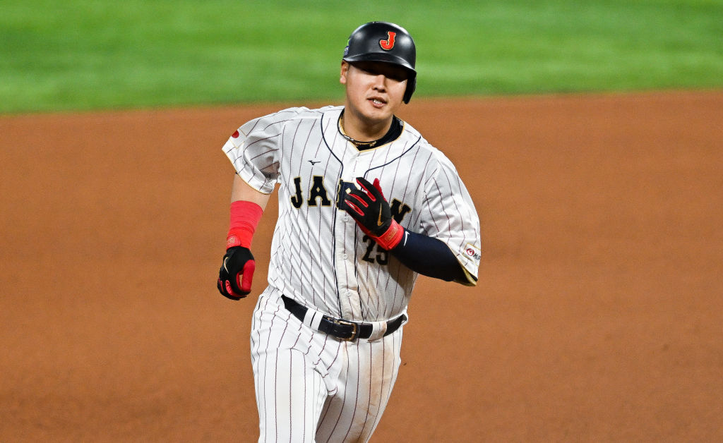 MIAMI, FLORIDA - MARCH 21: Kazuma Okamoto #25 of Team Japan hits a solo homerun in the bottom of the fourth inning during World Baseball Classic Championship between United States and Japan at loanDepot park on March 21, 2023 in Miami, Florida. (Photo by Gene Wang/Getty Images)