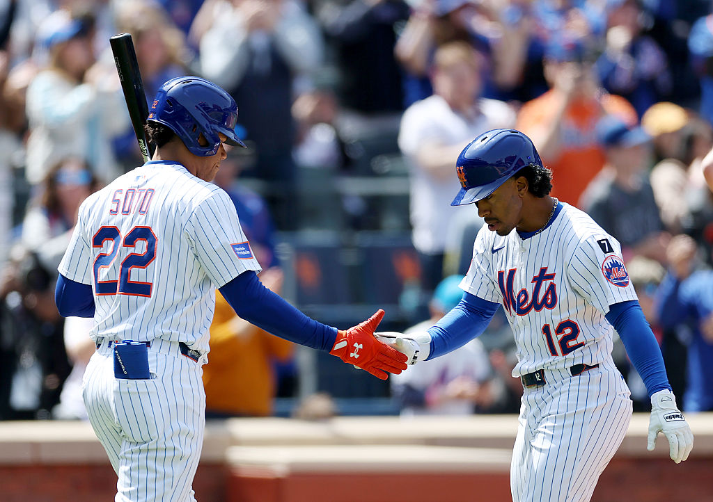 NEW YORK, NEW YORK - APRIL 20: Francisco Lindor #12 of the New York Mets is congratulated by on deck teammate Juan Soto #22 after Lindor hit a solo home run in the first inning against the St. Louis Cardinals at Citi Field on April 20, 2025 in the Flushing neighborhood of the Queens borough of New York City. (Photo by Elsa/Getty Images)
