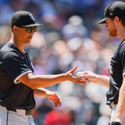 DENVER, CO - JULY 6: Manager Will Venable #1 of the Chicago White Sox takes the baseball from Shane Smith #64 as he exits the game in the fifth inning against the Colorado Rockies at Coors Field on July 6, 2025 in Denver, Colorado. (Photo by Justin Edmonds/Getty Images)