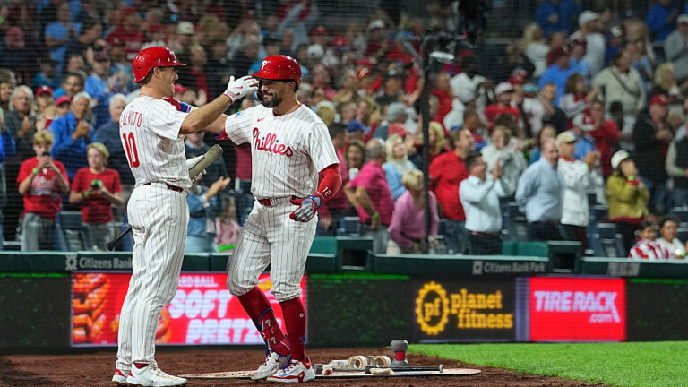 PHILADELPHIA, PENNSYLVANIA - SEPTEMBER 9: Kyle Schwarber #12 of the Philadelphia Phillies celebrates with J.T. Realmuto #10 after hitting a three run home run in the bottom of the seventh inning against the New York Mets at Citizens Bank Park on September 9, 2025 in Philadelphia, Pennsylvania. The home run was the 50th on the season for Kyle Schwarber. The Phillies defeated the Mets 9-3. (Photo by Mitchell Leff/Getty Images)