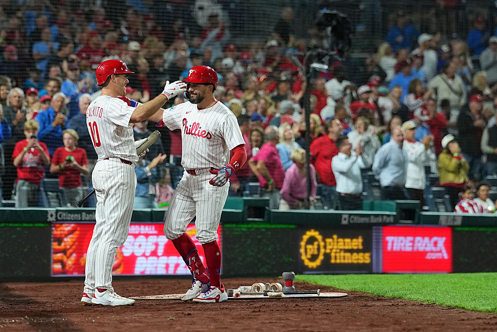 PHILADELPHIA, PENNSYLVANIA - SEPTEMBER 9: Kyle Schwarber #12 of the Philadelphia Phillies celebrates with J.T. Realmuto #10 after hitting a three run home run in the bottom of the seventh inning against the New York Mets at Citizens Bank Park on September 9, 2025 in Philadelphia, Pennsylvania. The home run was the 50th on the season for Kyle Schwarber. The Phillies defeated the Mets 9-3. (Photo by Mitchell Leff/Getty Images)