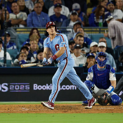 LOS ANGELES, CALIFORNIA - OCTOBER 08: J.T. Realmuto #10 of the Philadelphia Phillies reacts after hitting a solo home run against the Los Angeles Dodgers during the eighth inning in game three of the National League Division Series at Dodger Stadium on October 08, 2025 in Los Angeles, California. (Photo by Harry How/Getty Images)