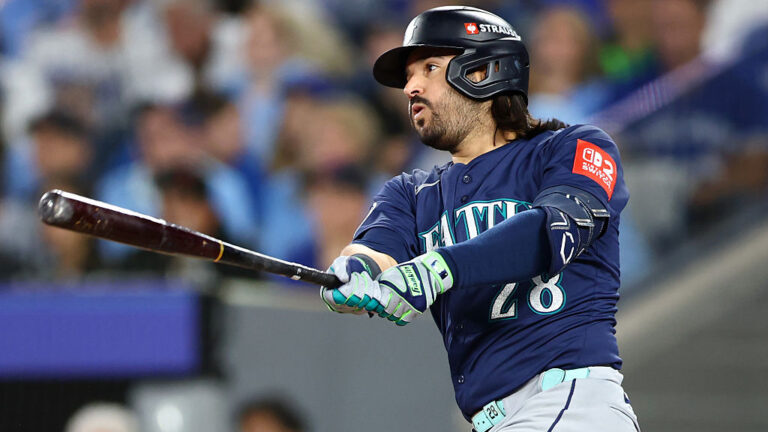 TORONTO, ONTARIO - OCTOBER 20: Eugenio Suarez #28 of the Seattle Mariners hits a single during the second inning against the Toronto Blue Jays in game seven of the American League Championship Series at the Rogers Centre on October 20, 2025 in Toronto, Ontario. (Photo by Vaughn Ridley/Getty Images)