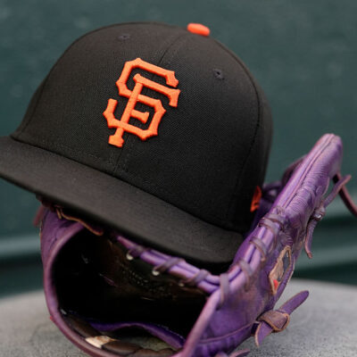 SAN FRANCISCO, CALIFORNIA - AUGUST 11: A detailed view of the cap and baseball glove belonging to Willy Adames #2 of the San Francisco Giants is seen in the dugout prior to the start of the game against the San Diego Padres at Oracle Park on August 11, 2025 in San Francisco, California. (Photo by Thearon W. Henderson/Getty Images)