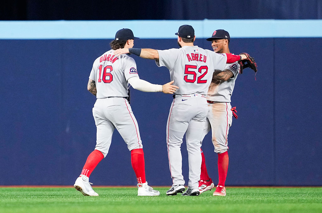 TORONTO, ON - SEPTEMBER 24: Jarren Duran #16, Wilyer Abreu #52, and Ceddanne Rafaela #3 of the Boston Red Sox celebrate after their team defeated the Toronto Blue Jays in their MLB game at Rogers Centre on September 24, 2025 in Toronto, Ontario, Canada. (Photo by Mark Blinch/Getty Images)