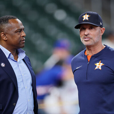 HOUSTON, TEXAS - MARCH 27: General Manager Dana Brown (L) and manager Joe Espada speak before the game against the New York Mets on Opening Day at Daikin Park on March 27, 2025 in Houston, Texas. (Photo by Tim Warner/Getty Images)