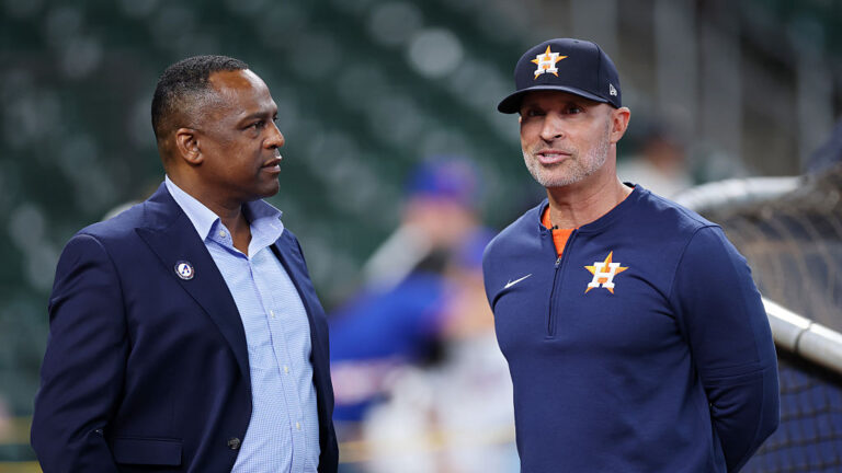 HOUSTON, TEXAS - MARCH 27: General Manager Dana Brown (L) and manager Joe Espada speak before the game against the New York Mets on Opening Day at Daikin Park on March 27, 2025 in Houston, Texas. (Photo by Tim Warner/Getty Images)