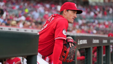 CINCINNATI, OHIO - SEPTEMBER 20: Austin Hays #12 of the Cincinnati Reds stands in the dugout prior to a baseball game against the Chicago Cubs at Great American Ball Park on September 20, 2025 in Cincinnati, Ohio. (Photo by Jeff Dean/Getty Images)