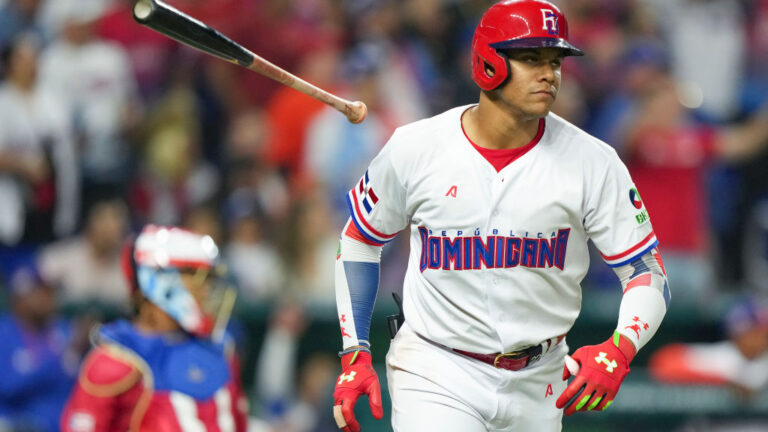 Juan Soto of the Dominican Republic hits a home run in the third inning of the World Baseball Classic Pool D game against Puerto Rico at loanDepot Park.
