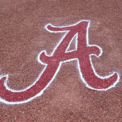 HOOVER, AL - MAY 23: A general view of the University of Alabama logo drawn onto gravel during the 2023 SEC Baseball Tournament game between the Kentucky Wildcats and the Alabama Crimson Tide on May 23, 2023 at Hoover Metropolitan Stadium in Hoover, Alabama. (Photo by Michael Wade/Icon Sportswire via Getty Images)