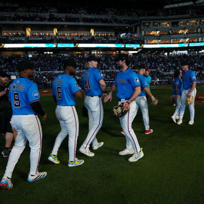 MIAMI, FLORIDA - SEPTEMBER 28: Xavier Edwards #9 of the Miami Marlins, Otto Lopez #6 of the Miami Marlins, Graham Pauley #21 of the Miami Marlins and Joey Wiemer #41 of the Miami Marlins celebrate after defeating the the New York Mets at loanDepot park on September 28, 2025 in Miami, Florida. (Photo by Jasen Vinlove/Miami Marlins/Getty Images)