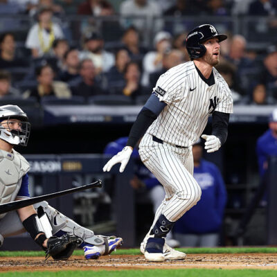 NEW YORK, NEW YORK - OCTOBER 08: Ryan McMahon #19 of the New York Yankees hits a solo home run against the Toronto Blue Jays during the third inning in game four of the American League Division Series at Yankee Stadium on October 08, 2025 in New York City. (Photo by Al Bello/Getty Images)