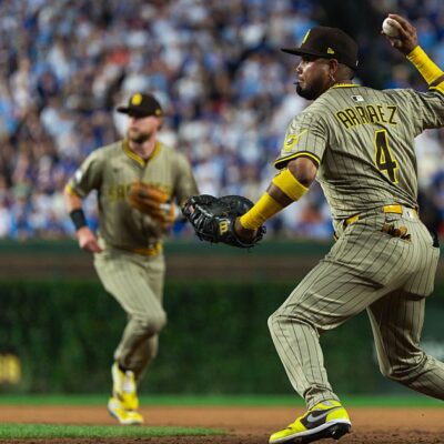 CHICAGO, ILLINOIS - OCTOBER 2: Luis Arraez #4 of the San Diego Padres throws the ball to home plate during game three of the National League Wild Card Series against the Chicago Cubs at Wrigley Field on October 2, 2025 in Chicago, Illinois. (Photo by Matt Thomas/San Diego Padres/Getty Images)