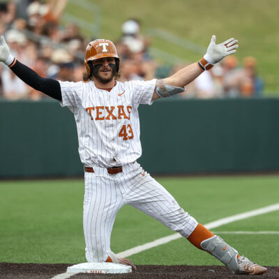 AUSTIN, TX - FEBRUARY 21: Outfielder Aiden Robbins #43 of the Texas Longhorns kneels on third base and holds his arms out after a triple during the college baseball game between Texas Longhorns and Michigan State Spartans on February 21, 2026, at UFCU Disch-Falk Field in Austin, TX. (Photo by David Buono/Icon Sportswire via Getty Images)