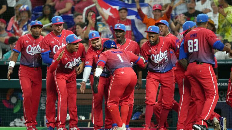 MIAMI, FLORIDA - MARCH 19: Roel Santos #1 of Team Cuba celebrates with teammates after scoring in the first inning against Team USA during the World Baseball Classic Semifinals at loanDepot park on March 19, 2023 in Miami, Florida. (Photo by Eric Espada/Getty Images)