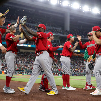 MIAMI, FLORIDA - MARCH 20: Randy Arozarena #56 of Team Mexico high fives teammates after the fifth inning a during the World Baseball Classic Semifinals at loanDepot park on March 20, 2023 in Miami, Florida. (Photo by Megan Briggs/Getty Images)
