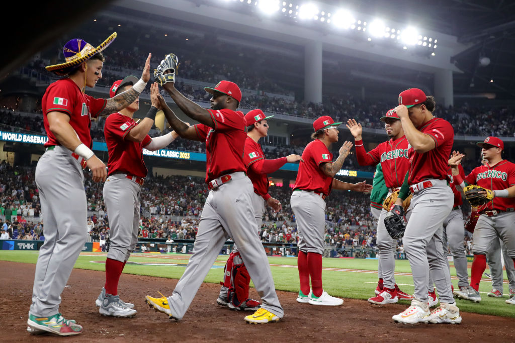 MIAMI, FLORIDA - MARCH 20: Randy Arozarena #56 of Team Mexico high fives teammates after the fifth inning a during the World Baseball Classic Semifinals at loanDepot park on March 20, 2023 in Miami, Florida. (Photo by Megan Briggs/Getty Images)